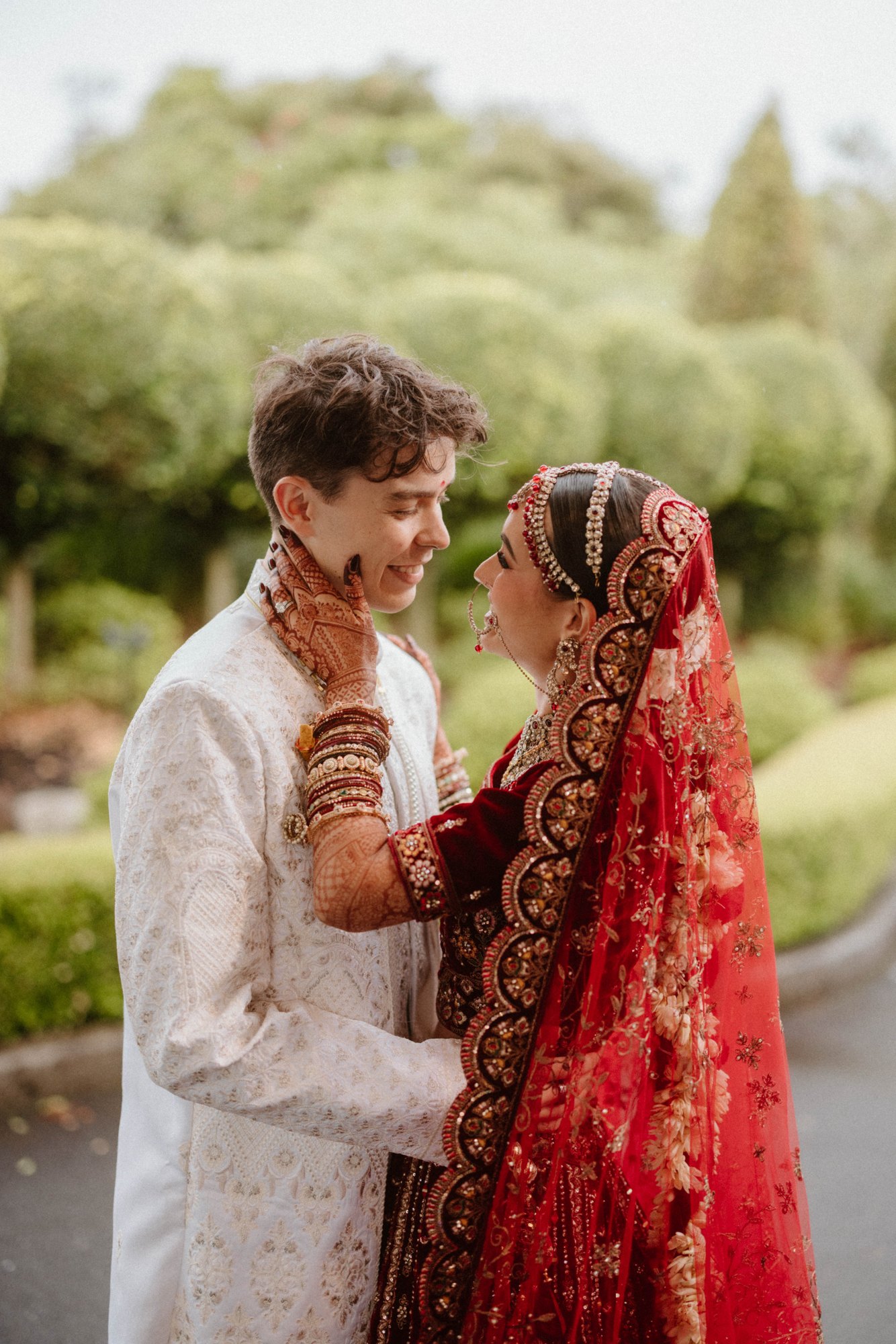 A couple sharing a tender moment outdoors