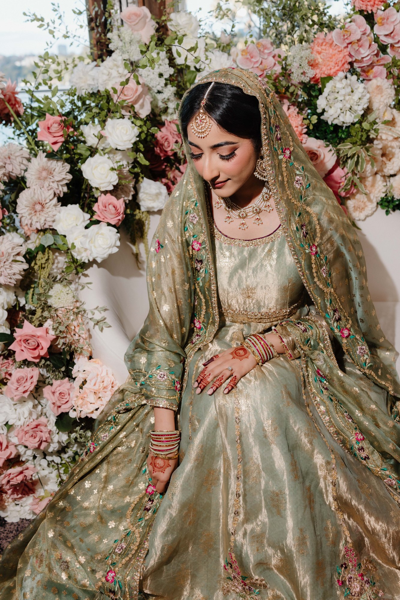A bride surrounded by flowers